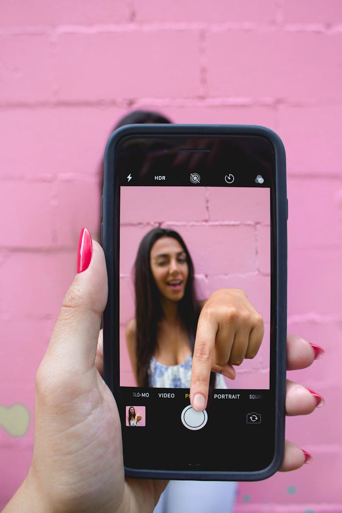 Photo of Person Holding iPhone